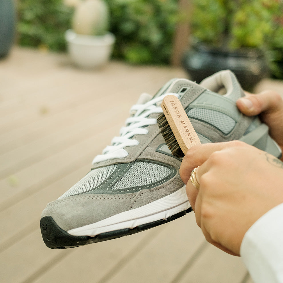 Man cleaning Suede Shoes with Suede Kit