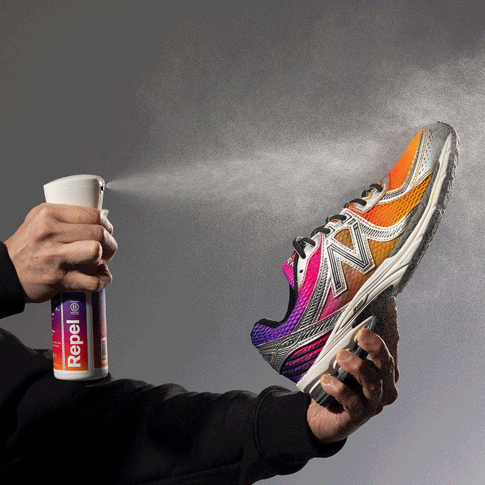 Guy spraying shoe with "Dusk" Repel Spray Jason Markk x LorenzOG.