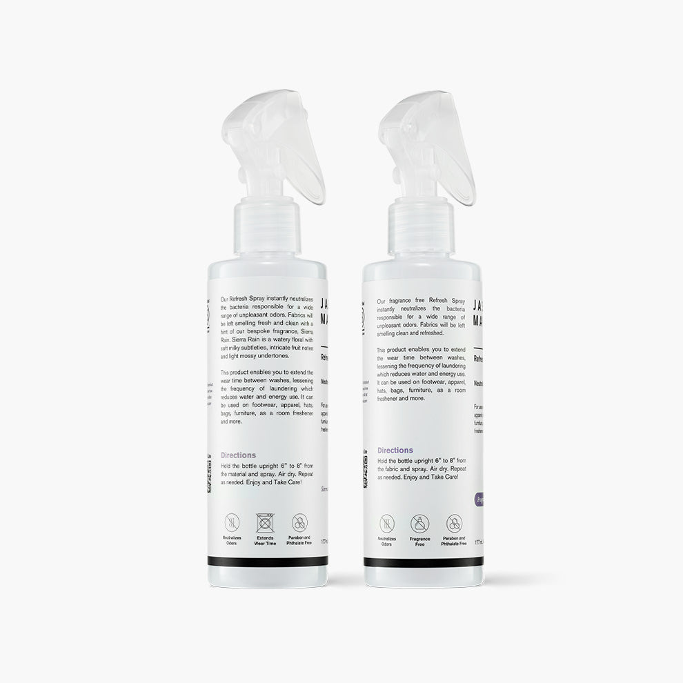 Jason Markk Refresh Spray in both Sierra Rain and Fragrance Free Scents back of the bottles, in front of a white background.