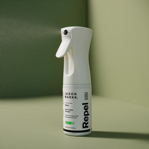 Jason Markk Repel Spraying On a green backdrop