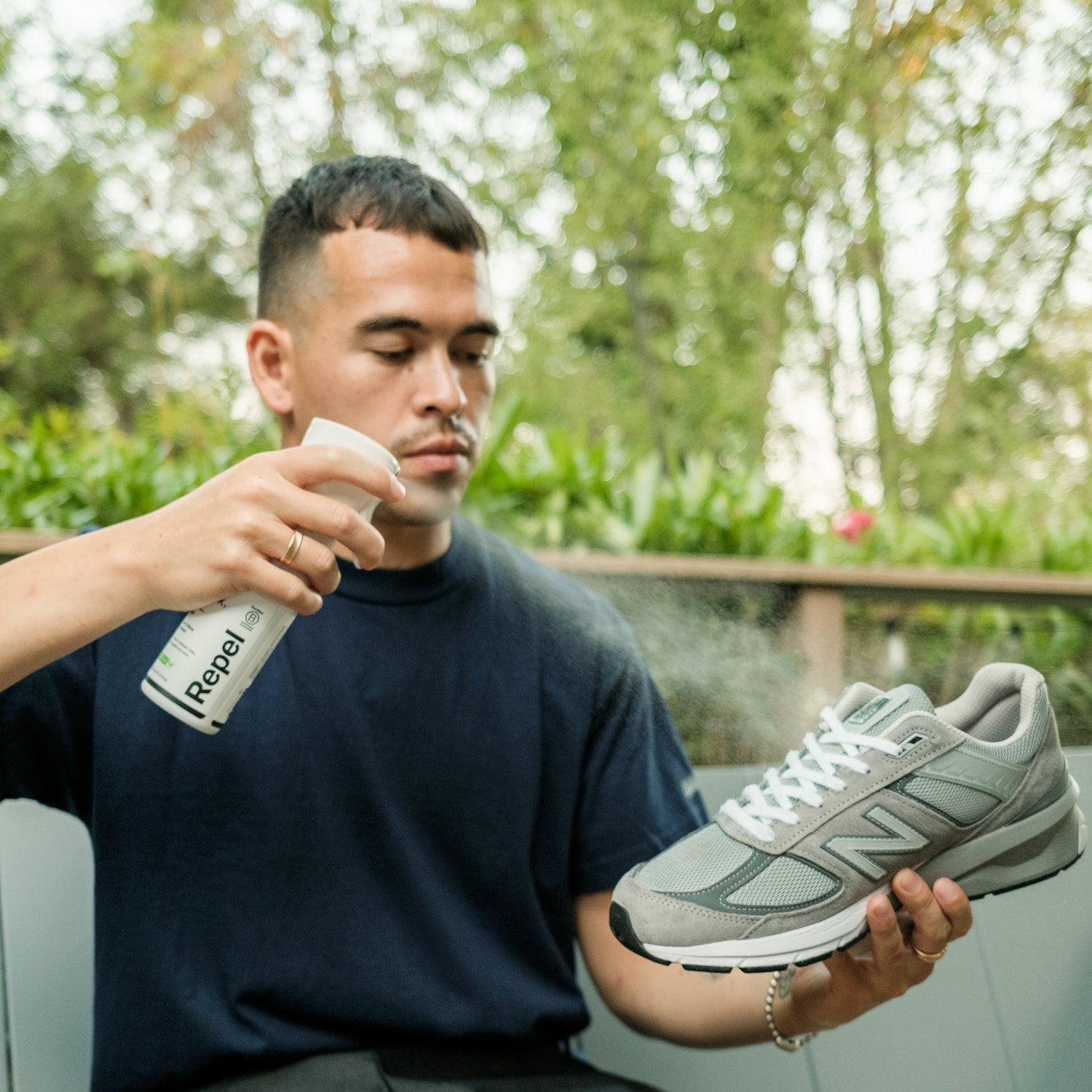 SPRAYING NEW BALANCE RUNNING SHOES WITH JASON MARKK REPEL SPRAY