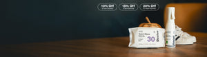 Jason Markk shoe care bundle offer: 10% Off 2 Item Bundle, 15% Off 3 Item Bundle, 20% Off 4+ Item Bundle. A pack of Jason Markk Revive Quick Wipes, 30 ready-to-use, lightly scented cleaning wipes for footwear, bags and apparel, sits beside Jason Markk Repel Stain & Water Repellent Spray on a wooden table. White leather sneakers with black stripes and a woven basket sit behind them.