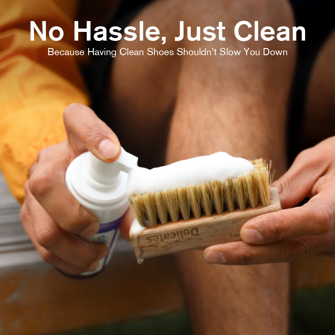 Person holding a Delicates brush and Ready-To-Use Foam bottle with text 'No Hassle, Just Clean.'