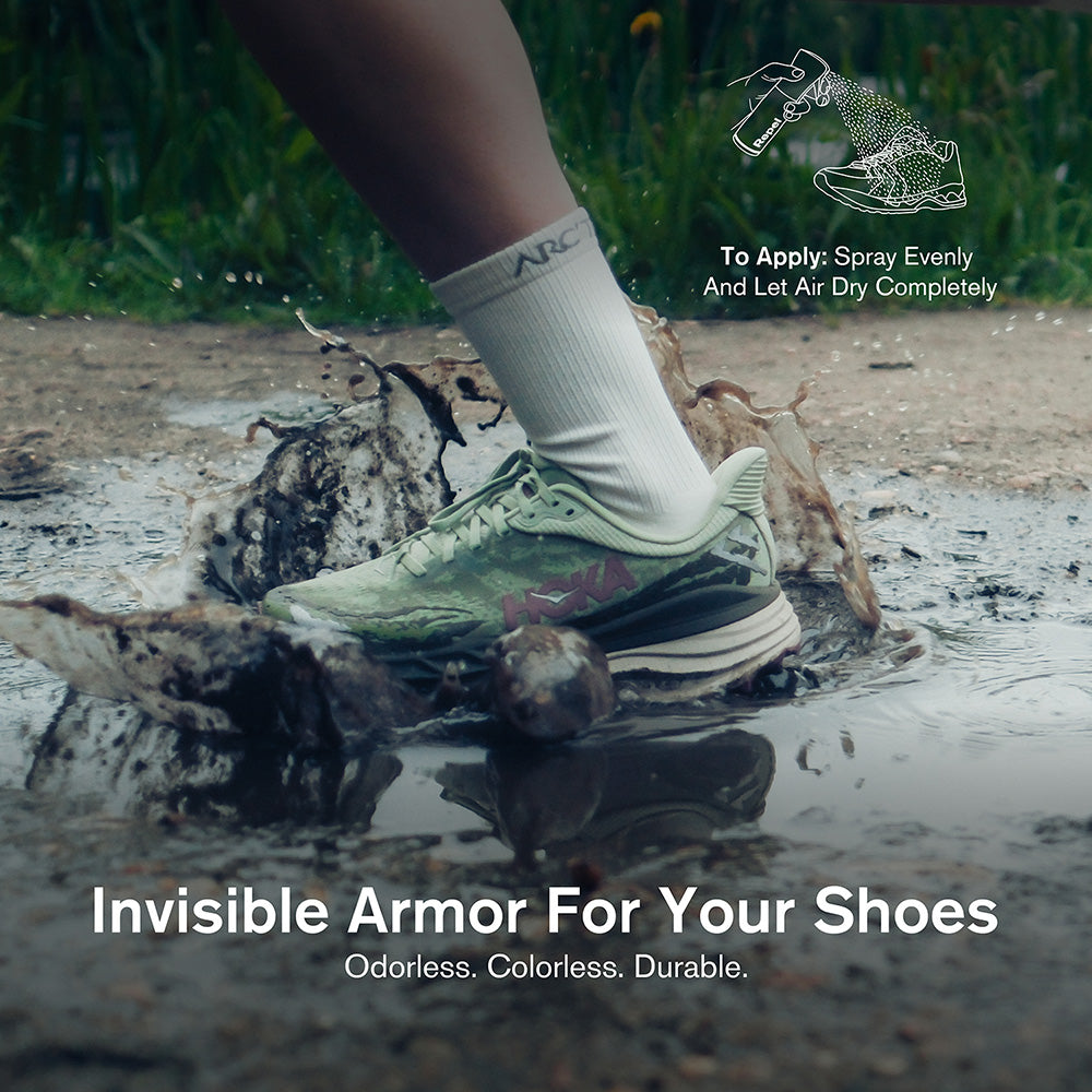 Person wearing a shoe with visible wear and tear stepping into a muddy puddle, promoting 'Invisible Armor For Your Shoes'.