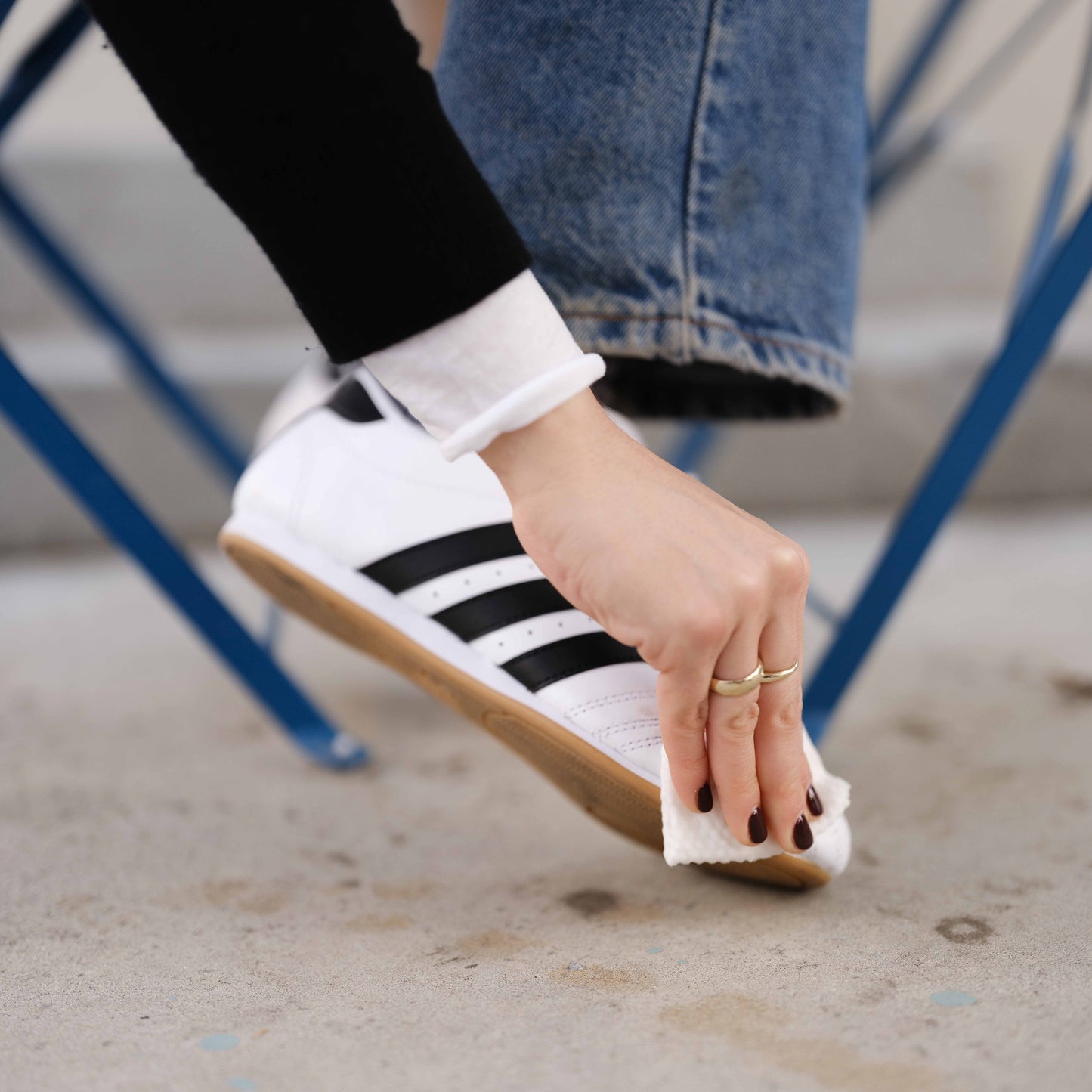 Woman wiping shoe with Jason Markk Quick Wipe
