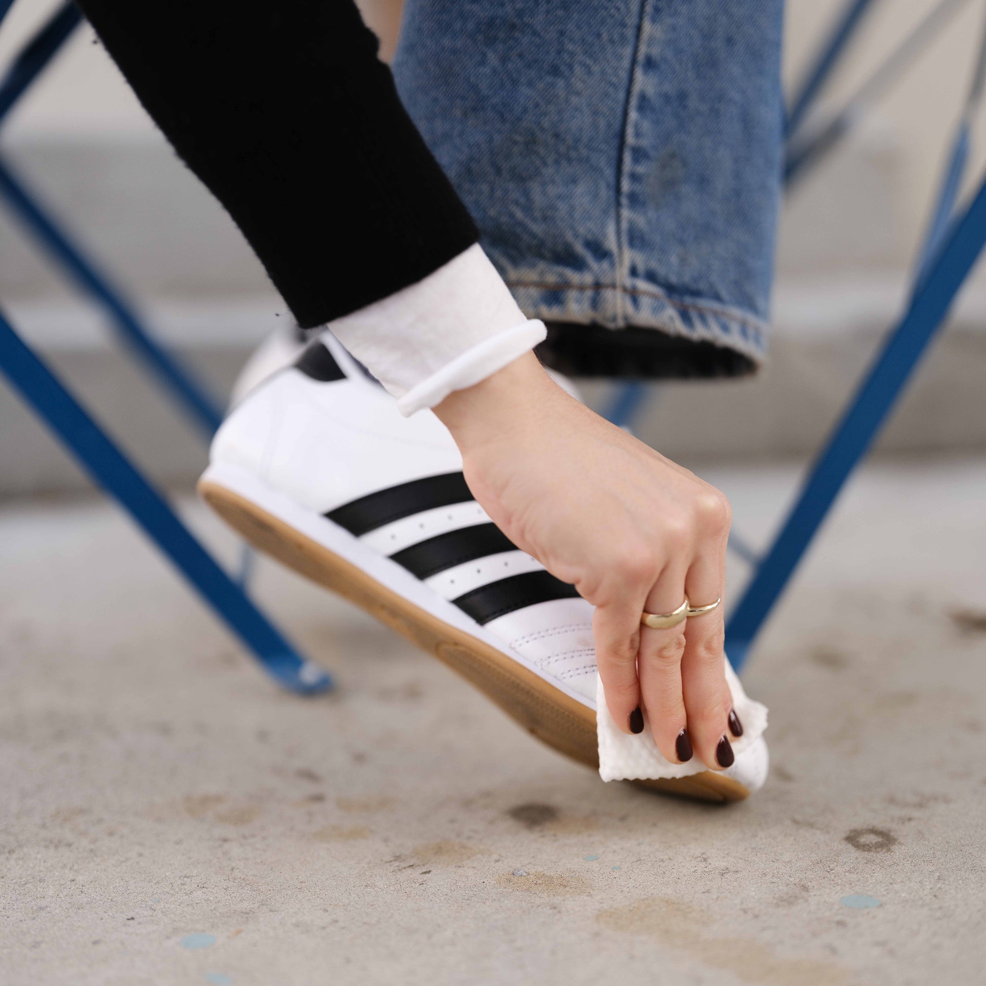 Woman wiping shoe with Jason Markk Quick Wipe