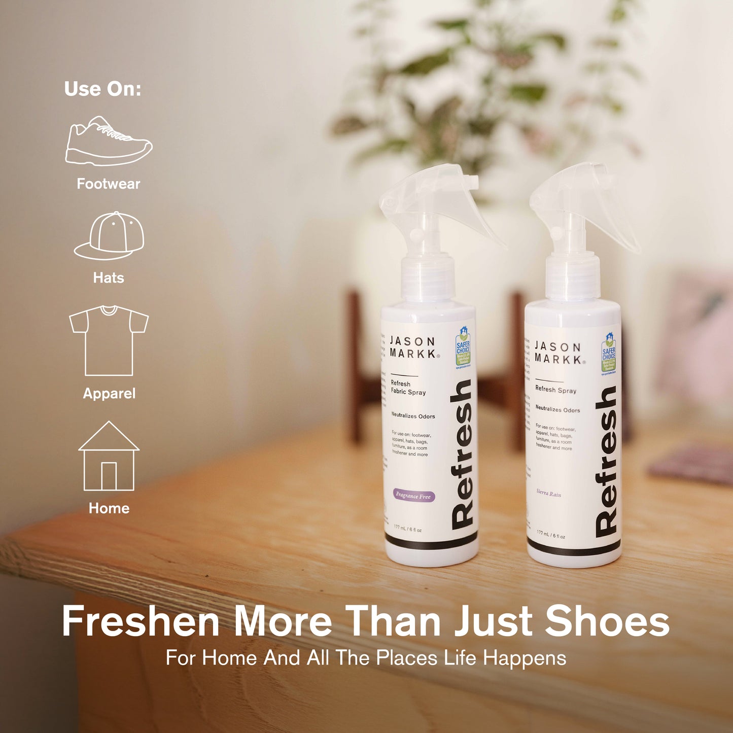 Two bottles of Jason Markk Refresh Spray on a wooden surface with a neutral background.