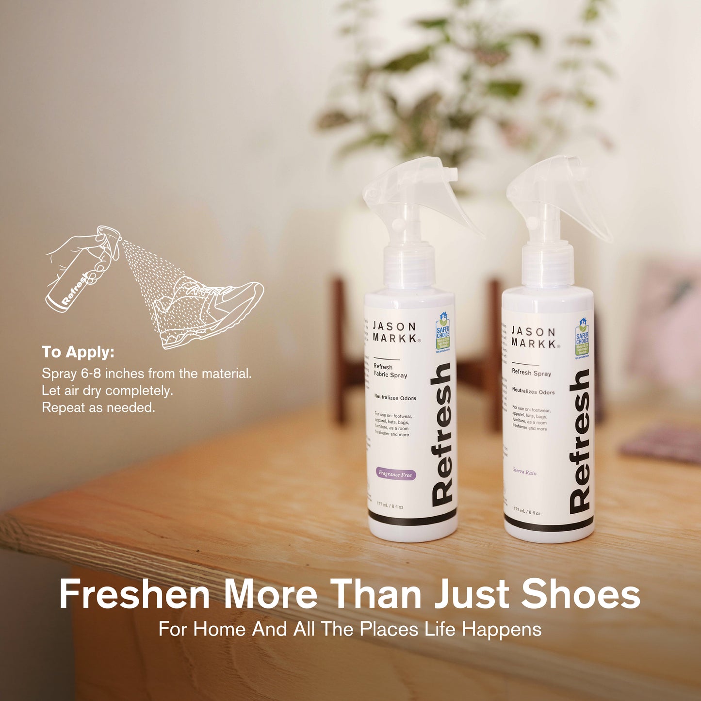 Two bottles of Jason Markk Refresh Spray on a wooden surface with a neutral background.