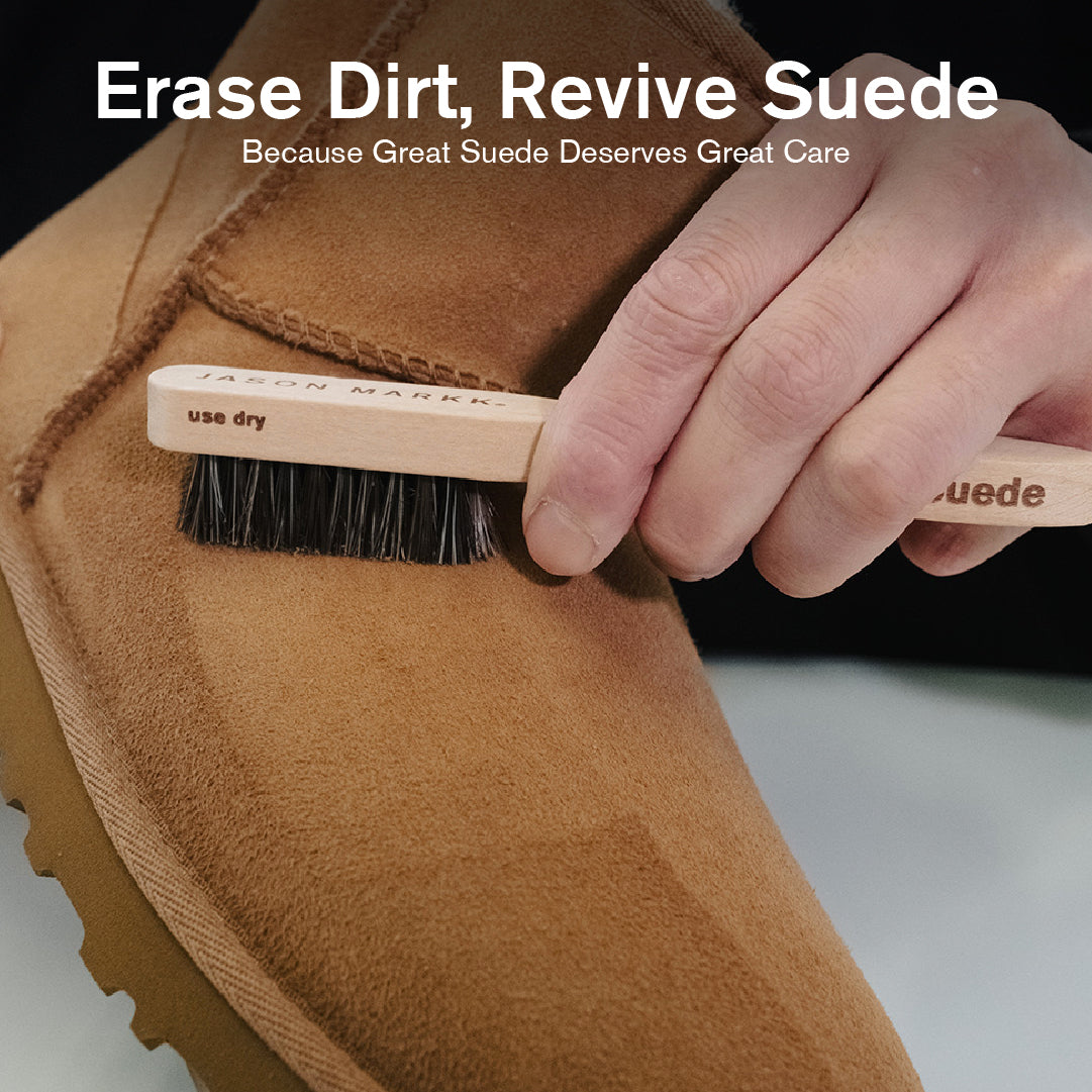 Person cleaning a brown suede Ugg boot with a Suede Brush labeled on a neutral background.