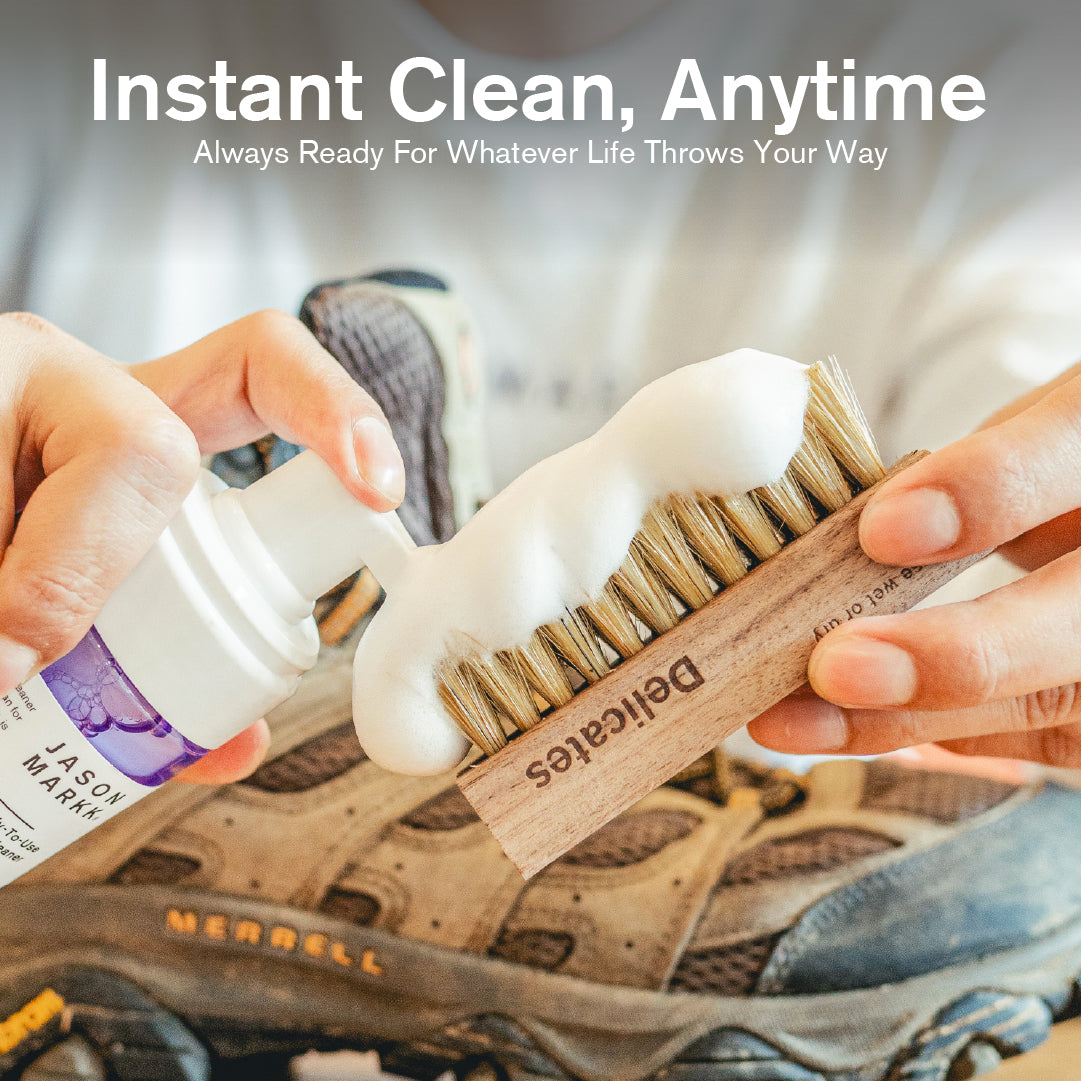Person cleaning a shoe with a Delicates Brush and bottle of RTU Foam with text 'Instant Clean, Anytime' above.