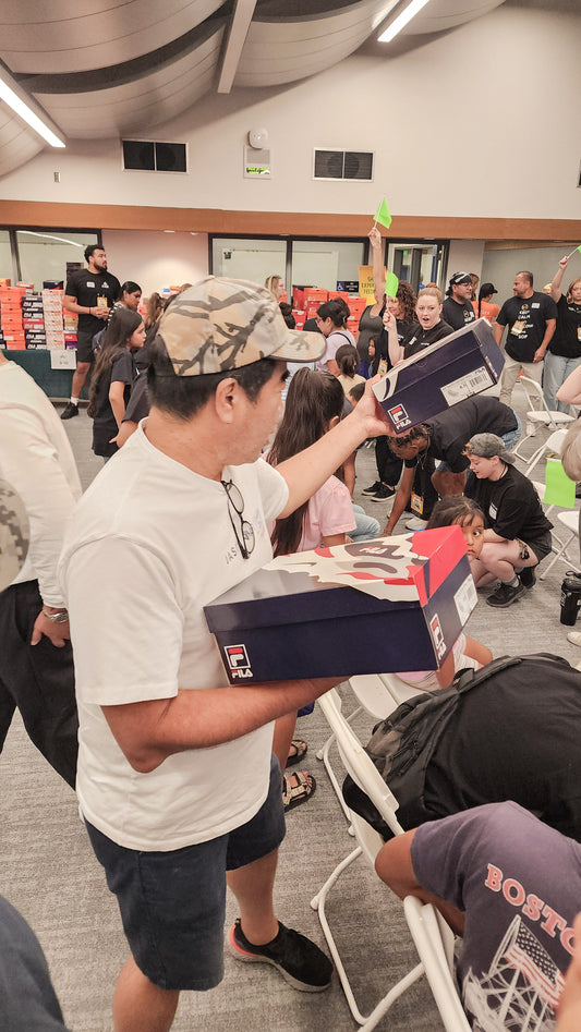 Jason Markk Staff Passing Out Shoes at Charity Event