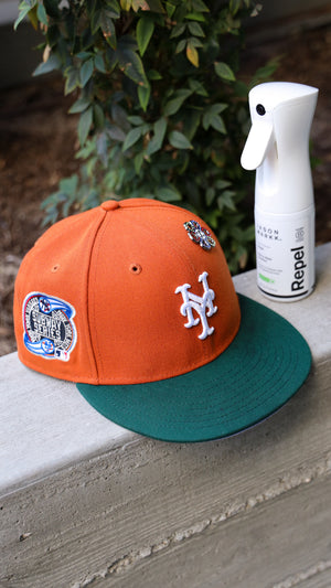 Orange and green baseball cap for New Your Mets with a bottle of Repel Spray