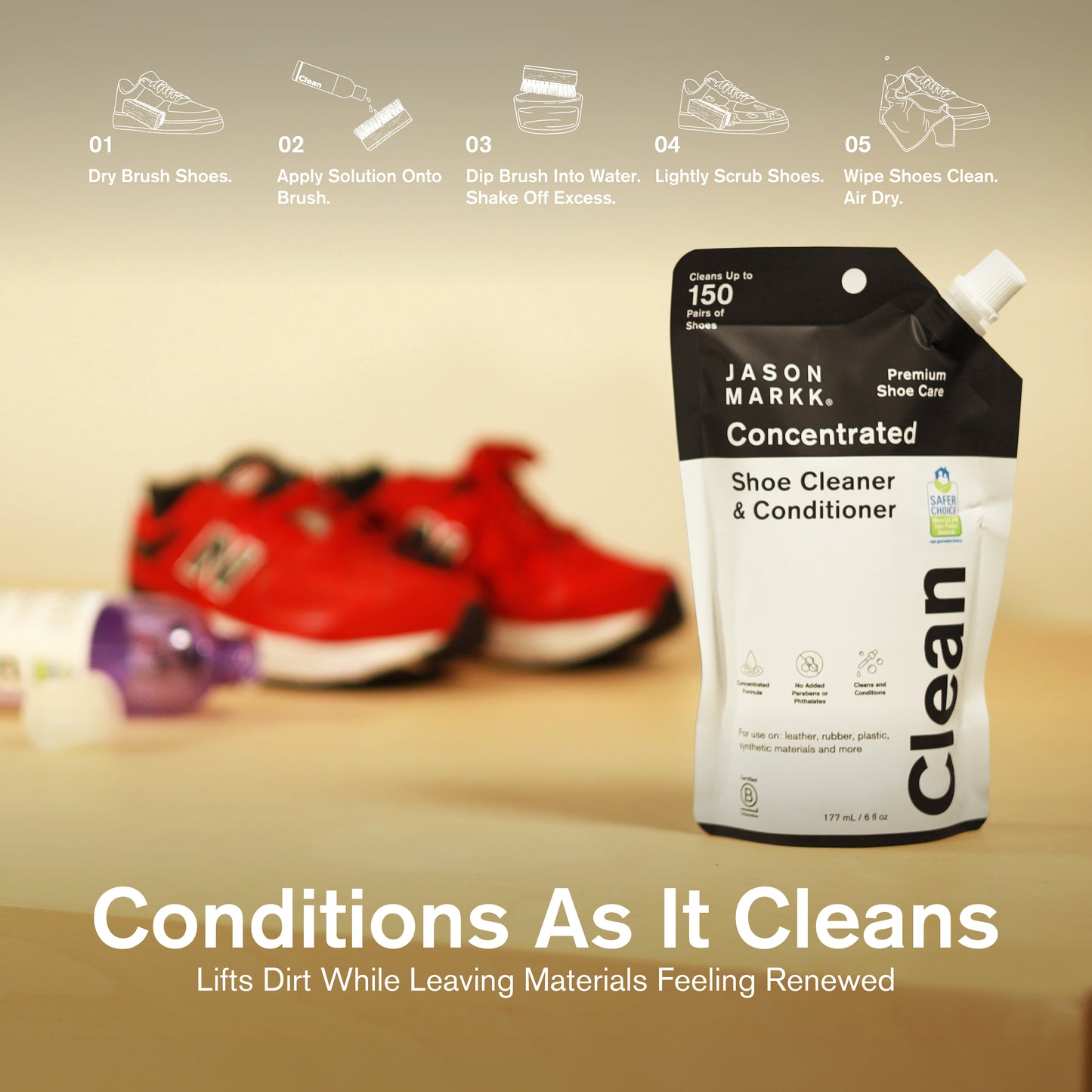 Jason Markk Concentrated Shoe Cleaner & Conditioner 177mL pouch displayed with red sneakers and cleaning brush. 5-step instructions: 1. Dry Brush Shoes. 2. Apply Solution Onto Brush. 3. Dip Brush Into Water, Shake Off Excess. 4. Lightly Scrub Shoes. 5. Wipe Shoes Clean, Air Dry. Text: "Conditions As It Cleans — Lifts Dirt While Leaving Materials Feeling Renewed." Cleans up to 150 pairs.