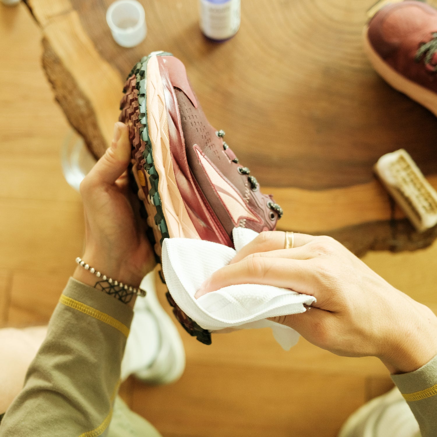 CLEANING A RED ALTRA RUNNING SHOE WITH A JASON MARKK MICROFIBER TOWEL 
