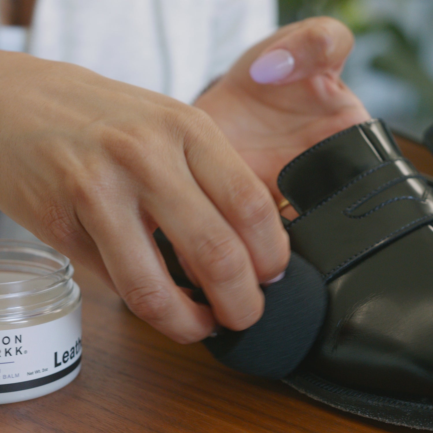 JASON MARKK LEATHER BALM APPLIED ON A PAIR OF BLACK MARGIELA TABI LOAFERS