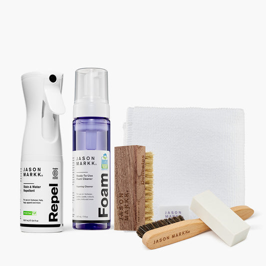 A photo showing the Jason Markk Repel Spray, 7oz Ready-To-Use Foam Cleaner, Delicates Brush, Microfiber Towel and Premium Suede Cleaning Kit out of package.