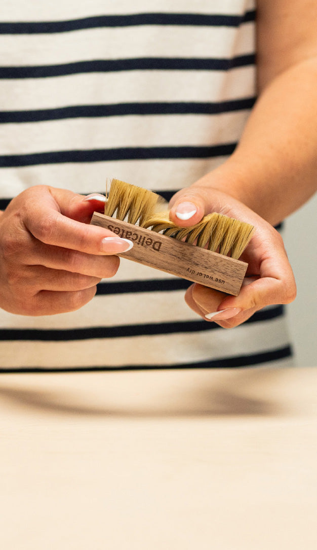 DRY BRUSHING SURFACE LEVEL DIRT FROM A PAIR OF SUEDE ADIDAS GAZELLE SHOES USING A JASON MARKK SUEDE CLEANING BRUSH