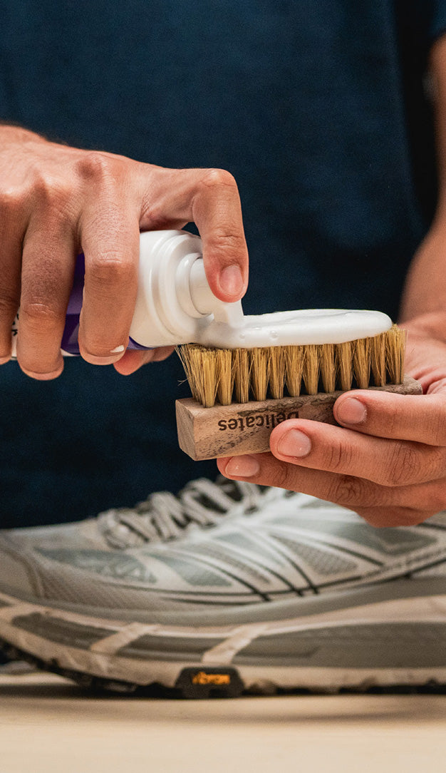 APPLYING JASON MARKK READY-TO-USE FOAM CLEANER ON A DELICATES CLEANING BRUSH 