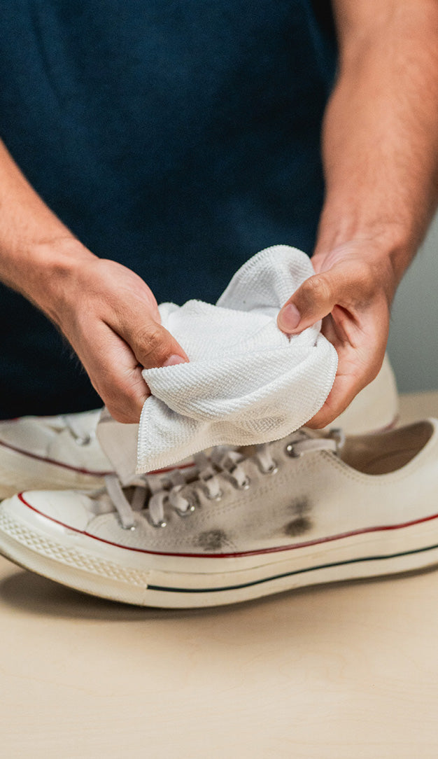 JASON MARKK MICROFIBER TOWEL SHOWN IN HAND TO SHOWCASE TEXTURE AND DURABILITY  