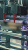 Video showing product standards in a factory with ending text overlay reads “B corp certification requires companies to:” followed by bullet points: “Provide ongoing full transparency to keep the certification,” “Rewrite corporate charter to benefit all stakeholders,” and “Meet stringent social and environmental goals.” Background shows blurred product setting, highlighting sustainability and ethical business standards.