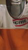 Video of grey shoe being dipped into orange liquid showing the effectiveness of Repel Spray.